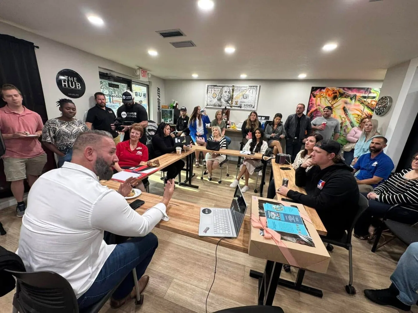 Regan Weiss leading a meeting at The Hub