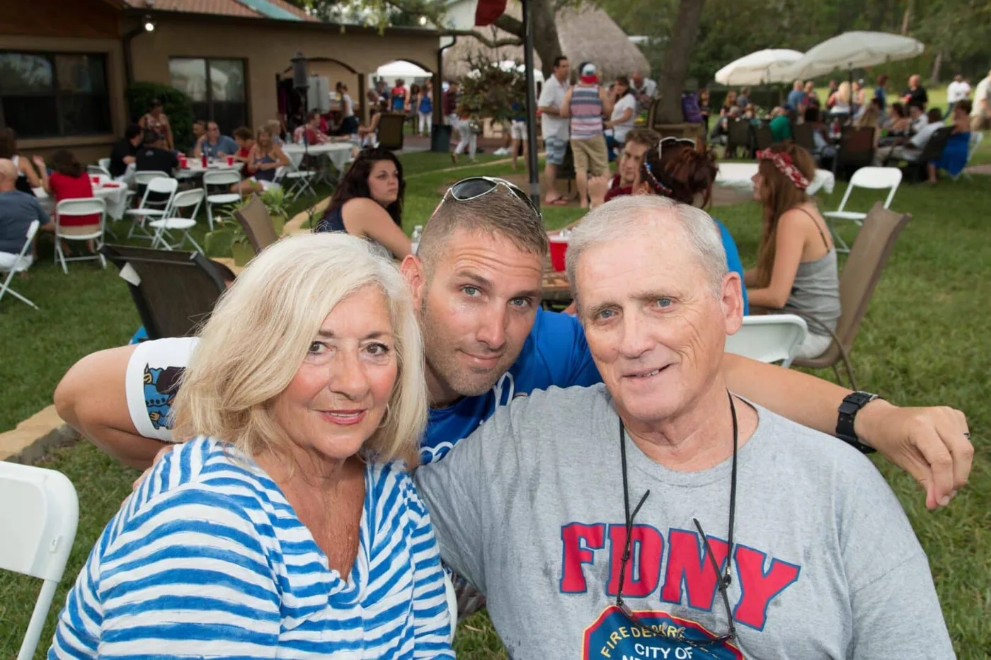 Regan Weiss with his parents at a community event