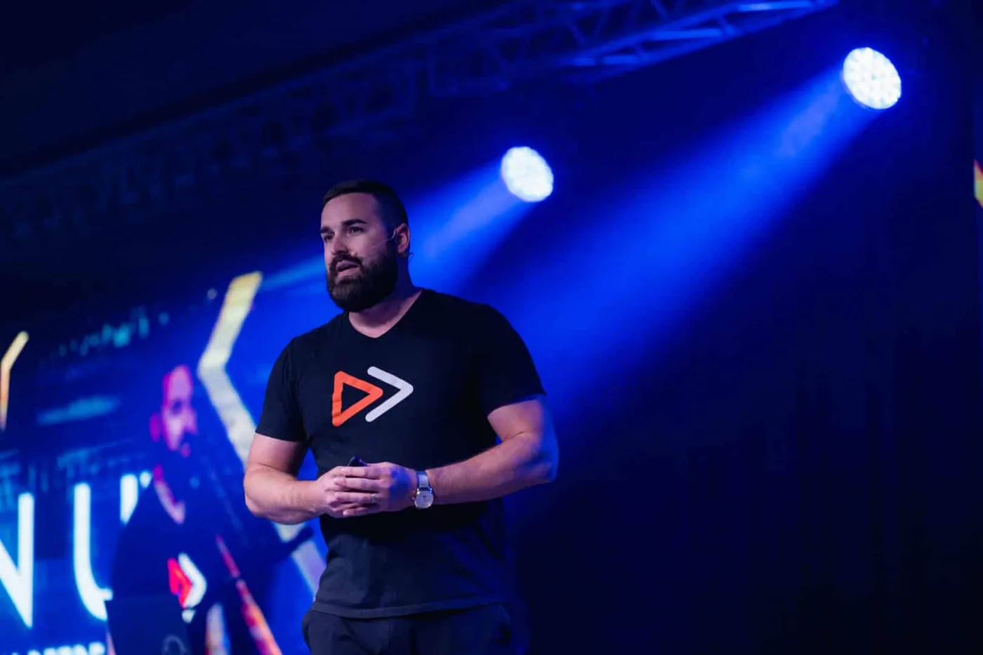 Jordan Lung speaking on stage at the TitanUp Retreat 2024