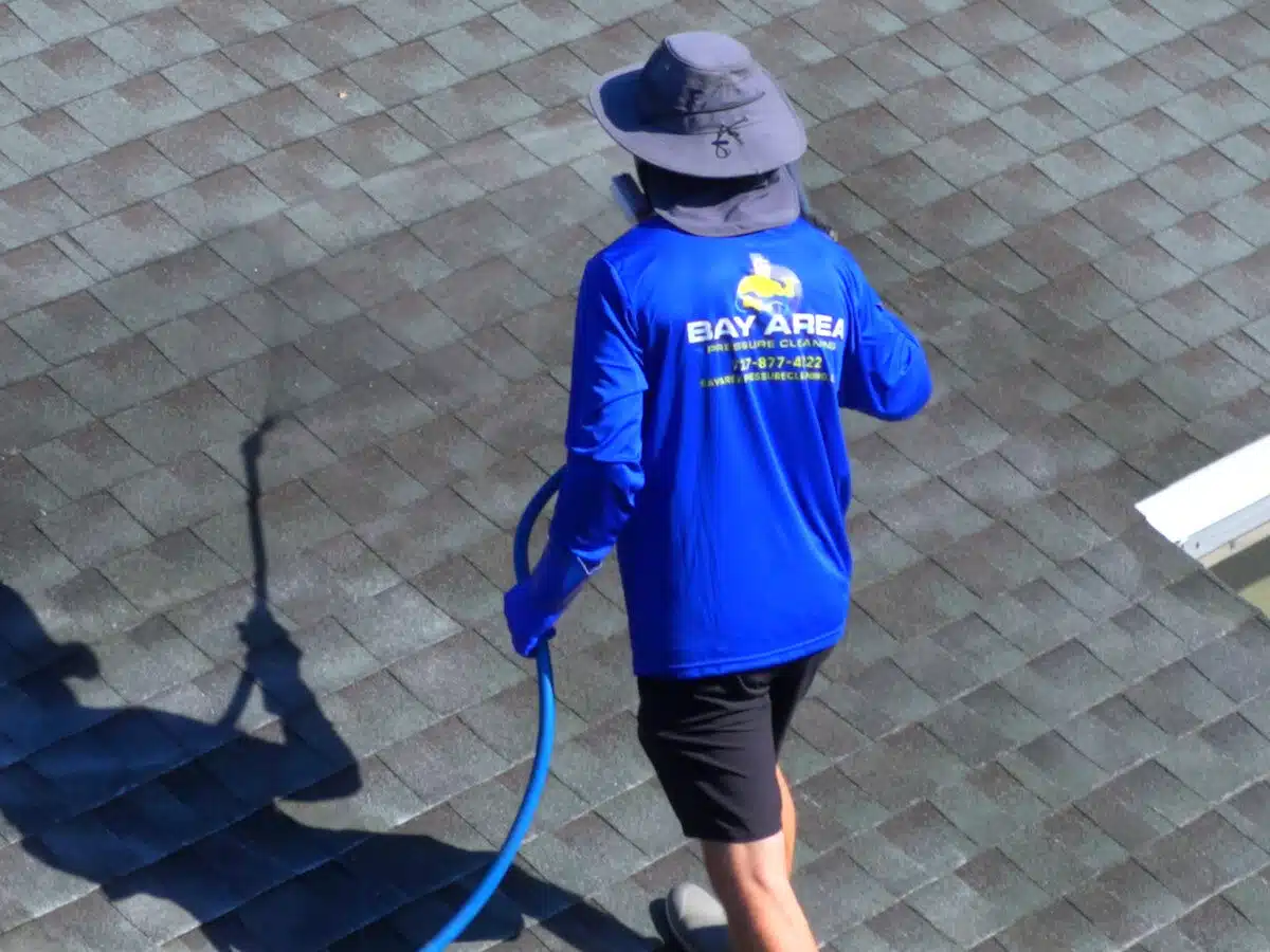 Bay Area Pressure Cleaning Spraying off a roof